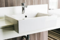 white-modern-sink-faucet-bathroom_74190-6105